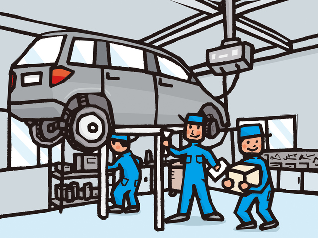 整備士が車の整備をしている画像